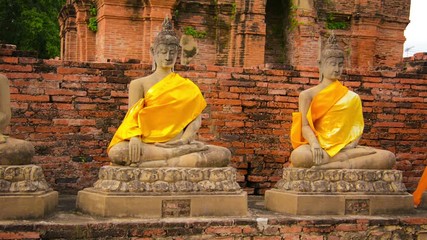 Wall Mural - Video 1920x1080 - Buddha statues in an old Buddhist temple. Thailand, Ayutthaya, Wat Yai Chaimongkhon