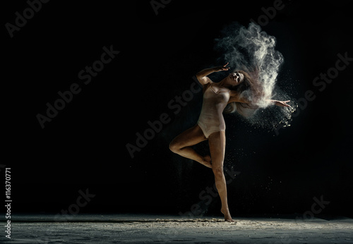 Amazing photo of graceful woman dancing with dust Plakát