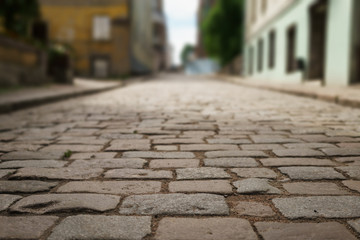 Wall Mural - perspective view of old paved road in town