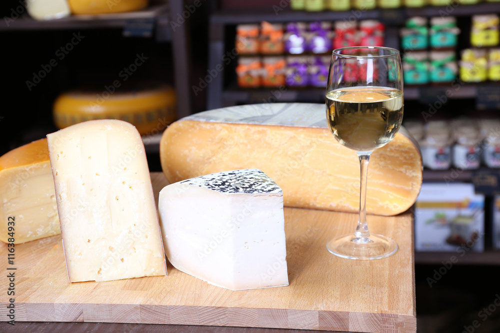 Fresh cheese with wine on the table in cellar