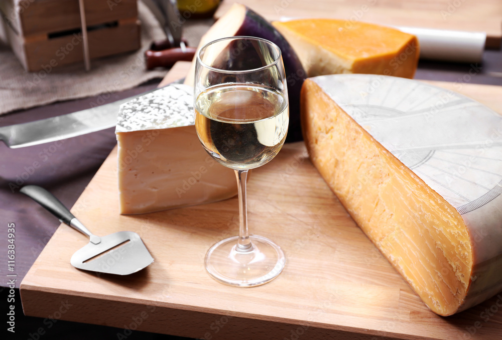 Fresh cheese with wine on the table in cellar
