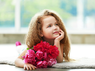 Beautiful girl holding fresh peonies bouquet on light background