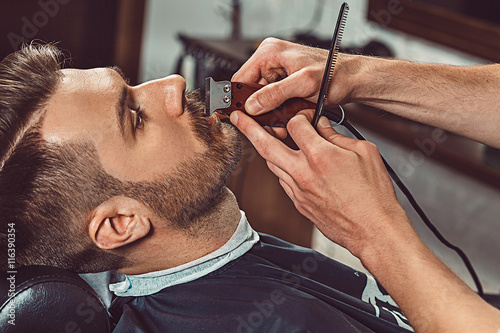 Hipster client visiting barber shop Wallpaper Mural