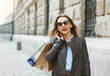 © vladstar - Beautiful woman with shopping bags in the ctiy