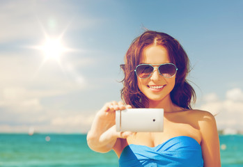 Poster - woman in bikini with phone