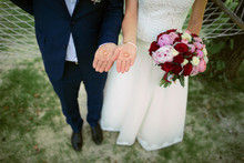 Couple Holding A Wedding Ring, A Wide Angle View From The Top