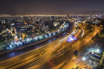 Fototapete - The skyline of Santiago de Chile by night.