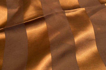 This is a photograph of Brown Polyester fabric with sheer insert