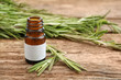 Dropper bottle and herbs on wooden background