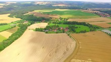 Camera Flight Over Small Village Chochol Near Prague. Civilization And Nature. Environmentally Friendly Living. Agriculture In Urban Landscape, Czech Republic, Europe. 