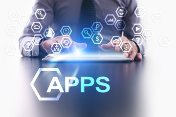 businessman is using tablet pc and selecting apps icon.