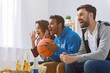 © Yakobchuk Olena - Friends watching sport on TV