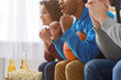 © Yakobchuk Olena - Friends watching sport on TV