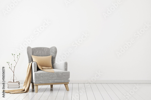 Fotografía Neutral interior with velvet armchair on empty white wall background