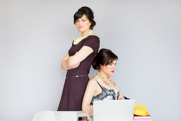 Wall Mural - two girl in a business suit and glasses