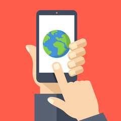 Poster - Earth icon on smartphone screen. Hand holding smartphone, finger touching screen. GPS navigation, traveling. Modern flat design vector illustration