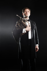 Classical musician with french horn