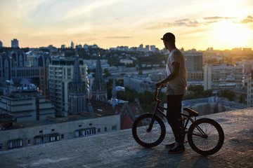 bmx freestyle. standing with his bmx.