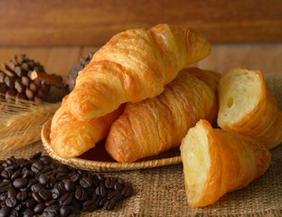 Wall Mural - croissant on wooden background