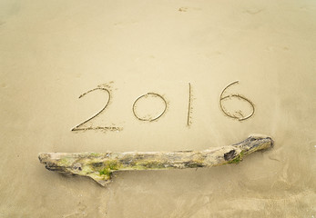 Wall Mural - Year 2016 hand written on the white sand in front of the sea