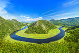 Fototapeta Miasto - Canyon of Rijeka Crnojevica river near the Skadar lake coast. One of the most famous views of Montenegro. River makes a turn between the mountains and flows backward.
