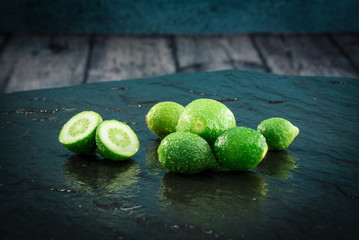 Small limes citrus fruit still unripe