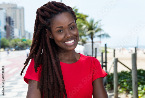 Laughing African Woman With Dreadlocks In The City Kaufen