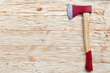 Axe On A Wooden Background