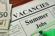 Newspaper with ads summer jobs vacancy. Occupation concept.
