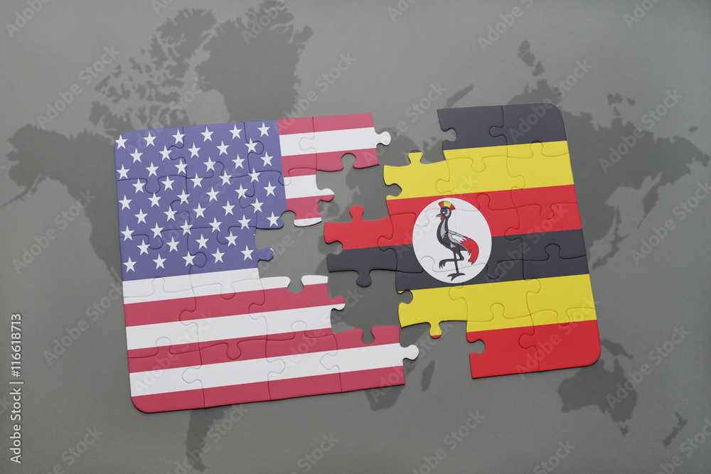 puzzle with the national flag of united states of america and uganda on ...
