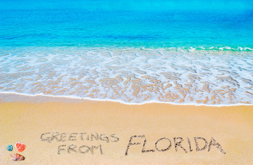 Wall Mural - greetings from FLorida written on a tropical beach