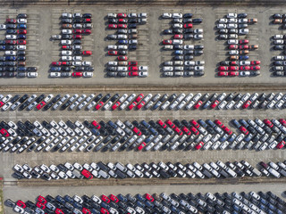 Aerial view lot of vehicles on parking for new car.