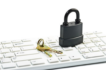 padlock and key on computer keyboard