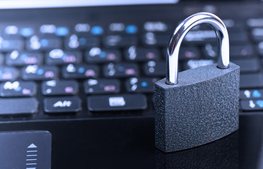 padlock on laptop computer keyboard