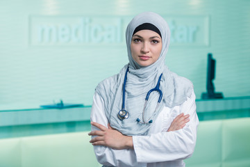 Wall Mural - Closeup portrait of friendly, smiling confident muslim female doctor.