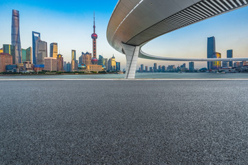 clean asphalt road with city skyline background,china.