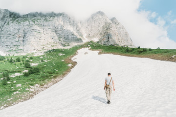 Poster - Man walking on snow in the mountains