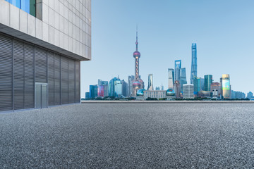 clean asphalt road front of shanghai cityscape,china.