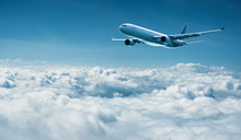 Airplane Flies Above Clouds - Air Travel