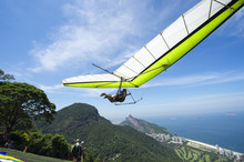 Hangglider Taking Off From The Ramp At Pedra Bonita, In The Tijuca National Forest, Heading Toward The Beach At São Conrado In Rio De Janeiro, Brazil
