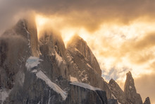 Sunlight Through Clouds Over Cerro Torre Mountain