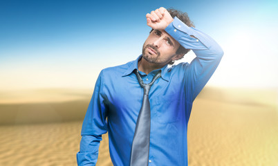 Wall Mural - Sweating businessman due to hot climate