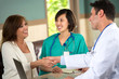 © digitalskillet1 - Doctor shaking hands with a patient.