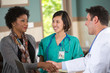 © digitalskillet1 - Doctor shaking hands with a patient.