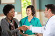 © digitalskillet1 - Doctor shaking hands with a patient.