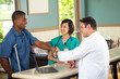 © digitalskillet1 - Doctor shaking hands with a patient.