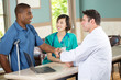 © digitalskillet1 - Doctor shaking hands with a patient.