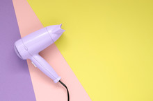 Purple Hair Dryer On Colorful Paper Background