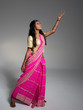 © ramoncarretero - Beautiful young indian woman acting and wearing a traditional sa
