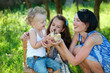 © Aliaksei Lasevich - family with little yellow duckling in summer Park